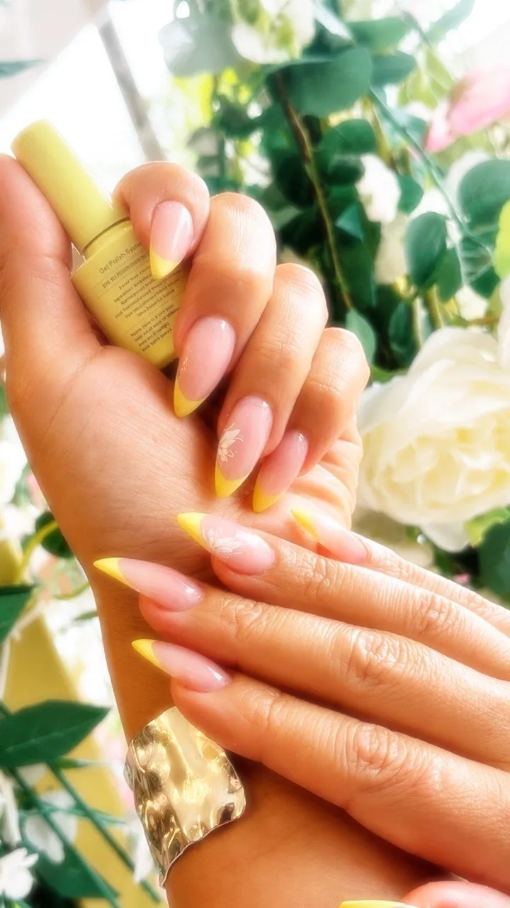 Sunny yellow french tips with white flower detailing
